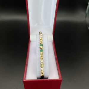 manilla en oro, plata, y esmeralda